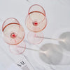 blush slanted wine glasses