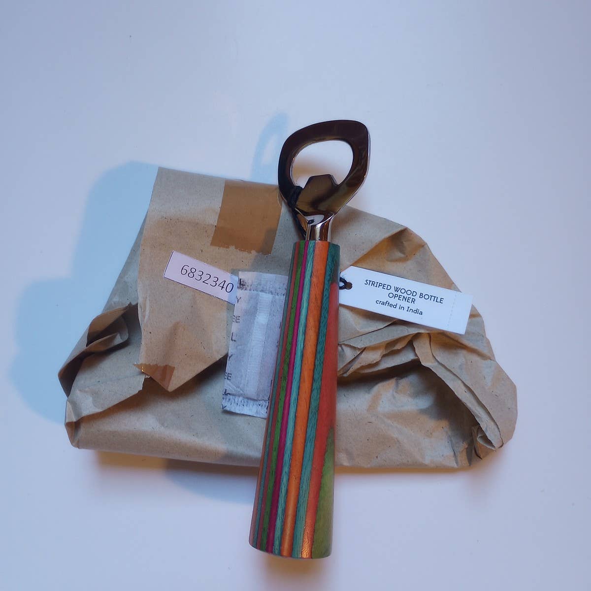striped wooden bottle opener