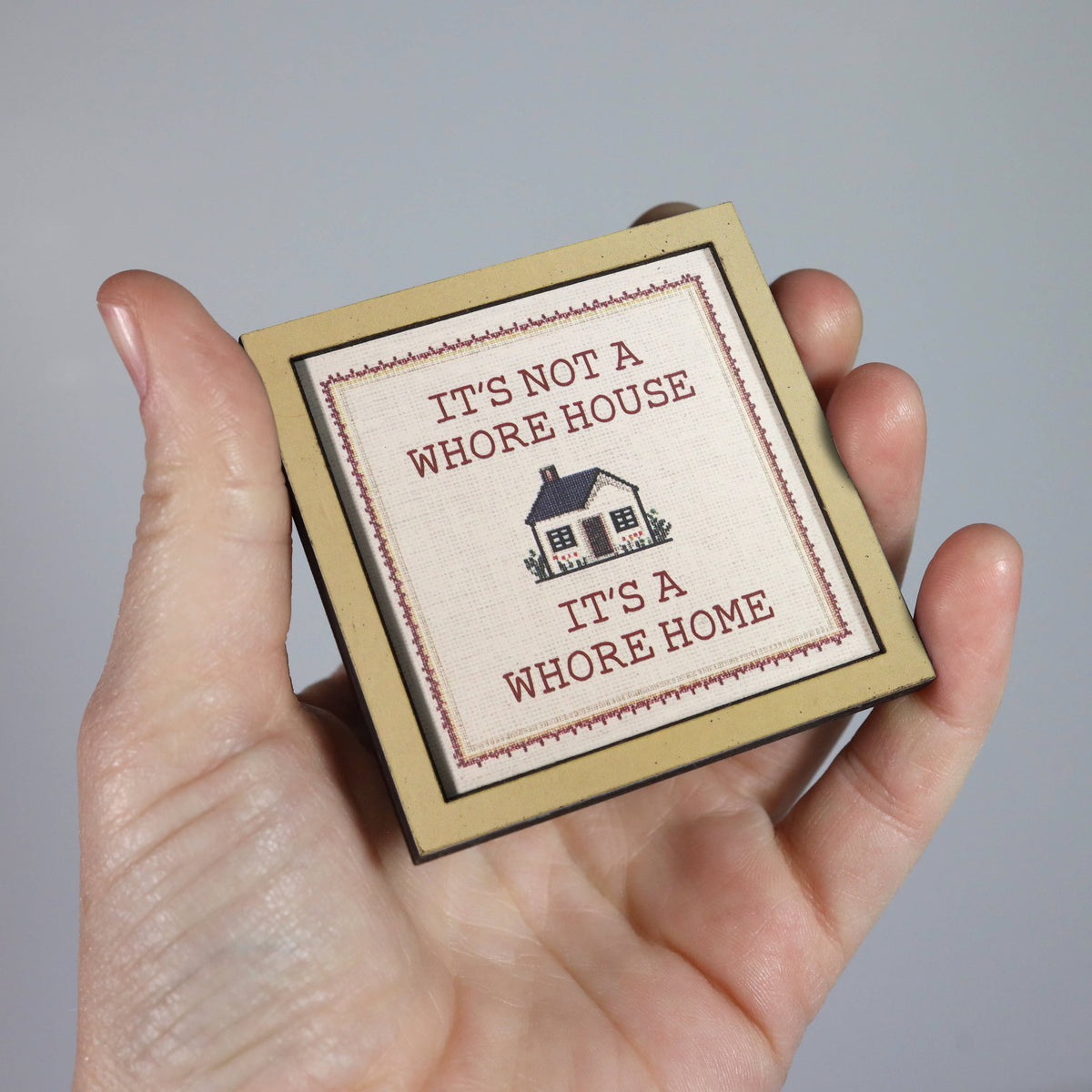 it's not a whore house. it's a whore home - wooden magnet