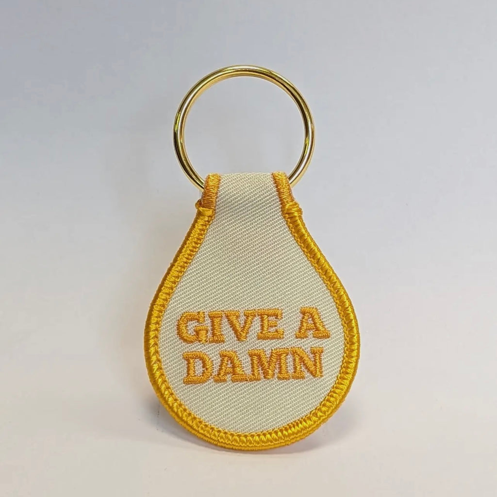 give a damn keychain